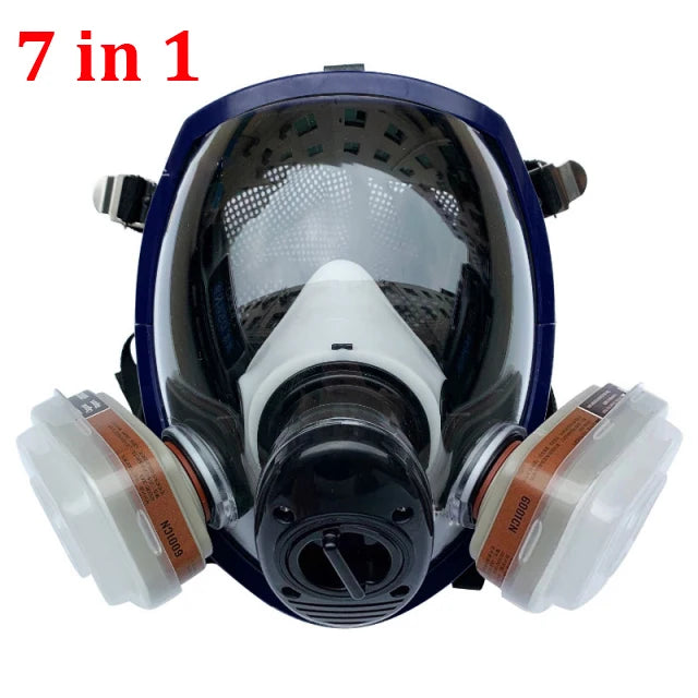 Full-face respirator mask with multiple filter cartridges on a white background