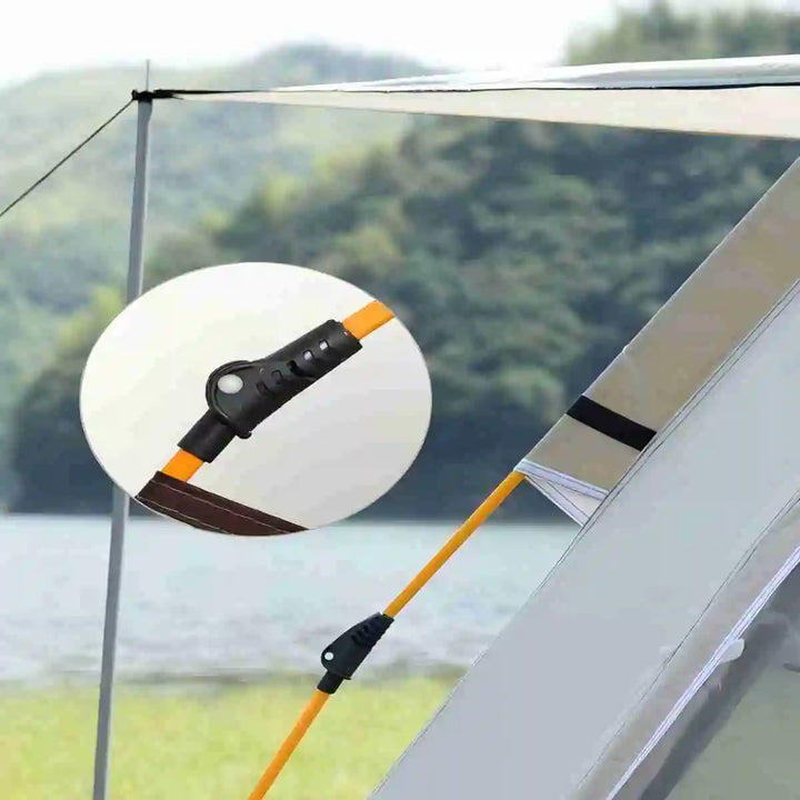 Reflective mirror attached to a tent with a blurred natural background