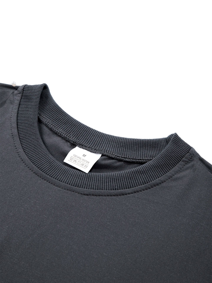 Close-up of a dark gray shirt collar with a visible tag on a white background