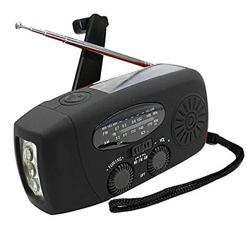 Black emergency radio with flashlight and antenna on a white background