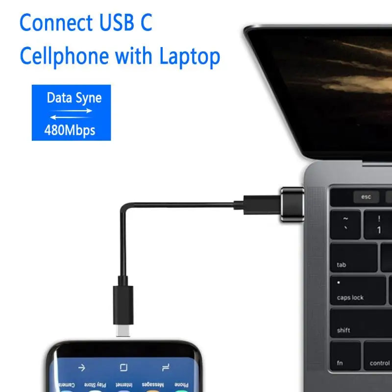 Close-up of USB adapter connecting laptop to Type-C cable