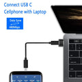 Close-up of USB adapter connecting laptop to Type-C cable