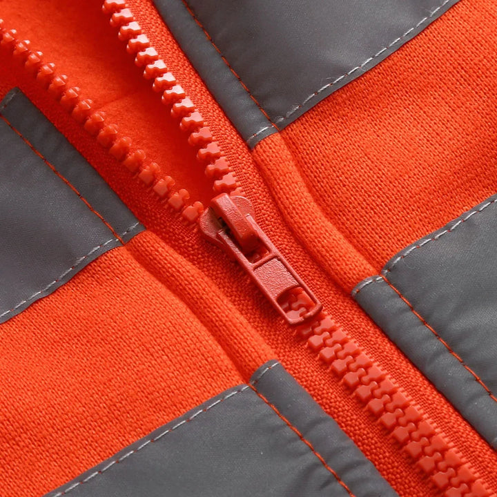 Close-up of a red and gray jacket zipper