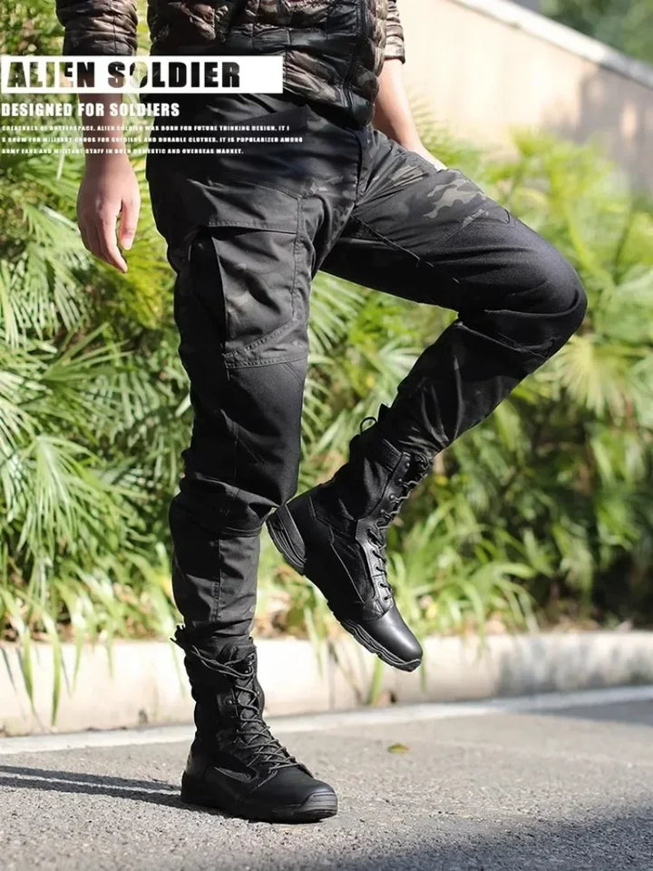 Person wearing black tactical boots and pants with 'ALIEN SOLDIER' branding.