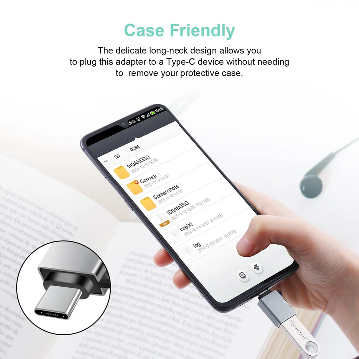 Phone with USB-C adapter held by a hand, showing compatibility with case-friendly design.