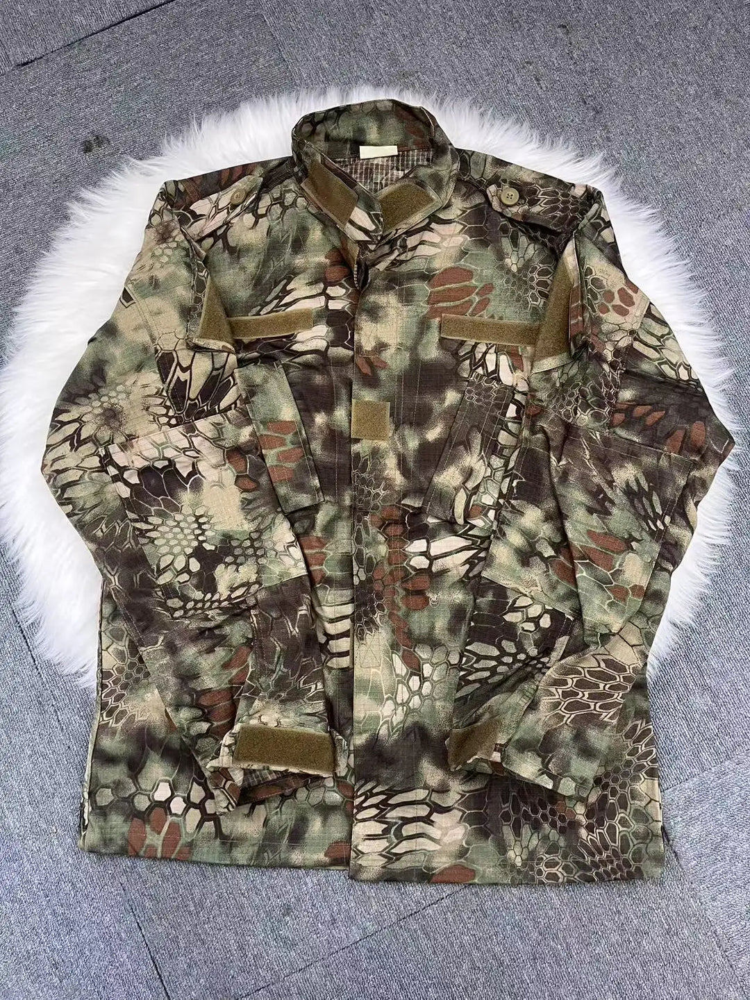 Camouflage jacket on a textured surface