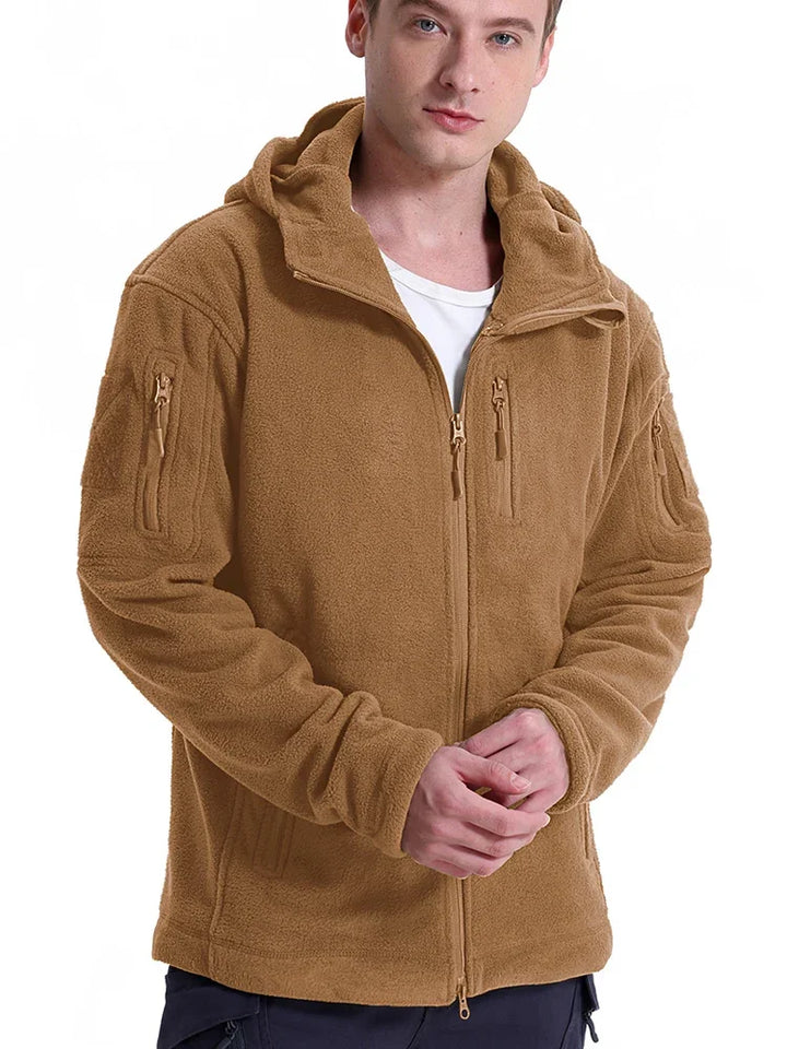 Man wearing a brown fleece jacket on a white background