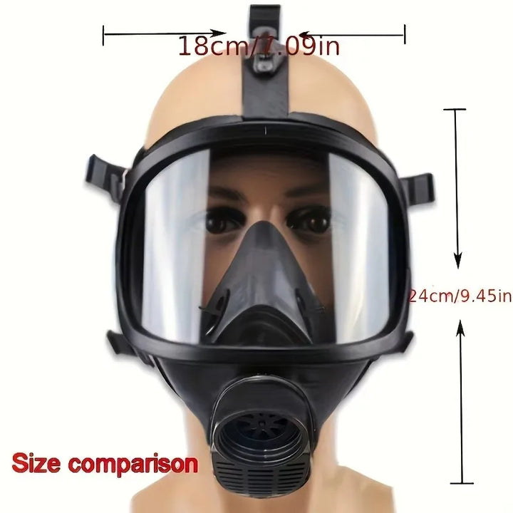 Black full-face mask with clear visor on a mannequin head, showing size comparison measurements.
