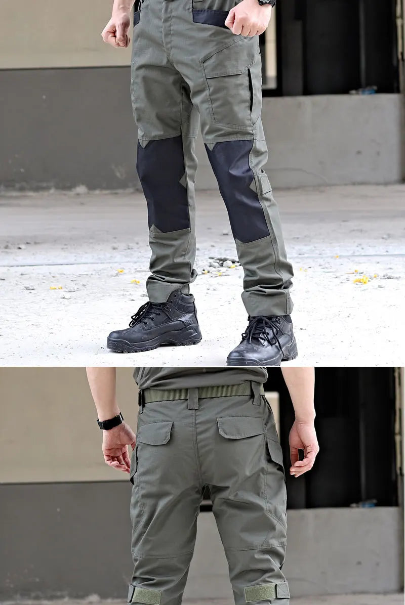 Gray cargo pants with black boots on a concrete surface.