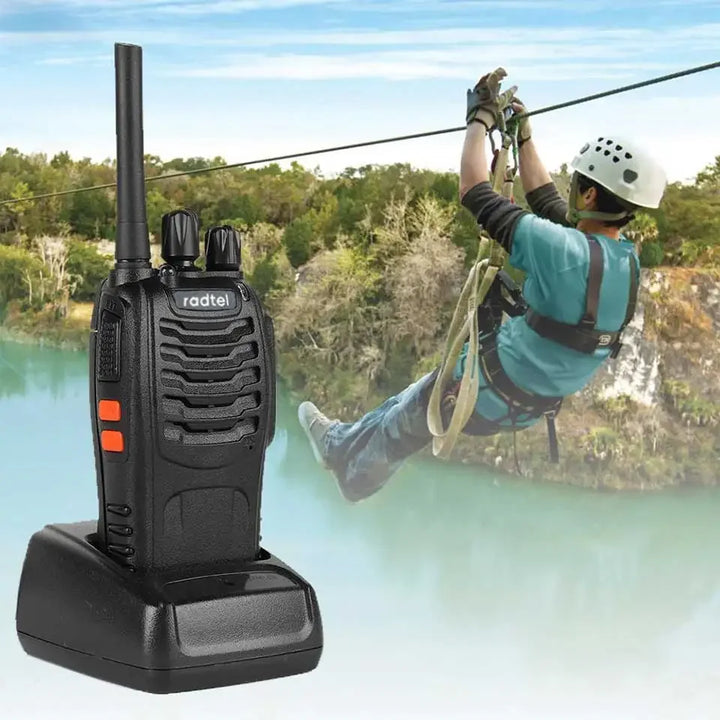 Baofeng walkie-talkie with a person on a zip line in the background