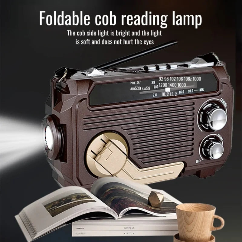 Foldable cob reading lamp with radio and light features, placed on books with a cup and pen.