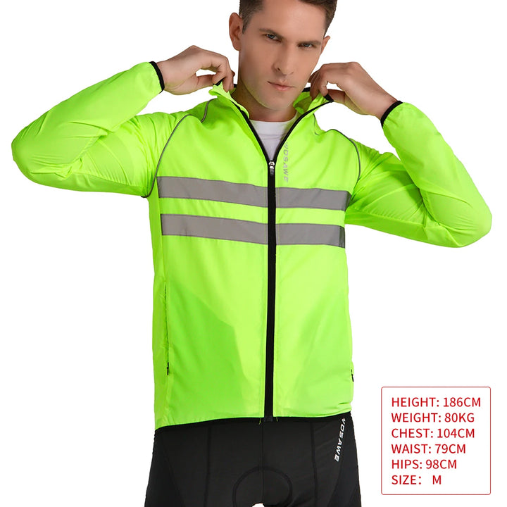 Person wearing a bright green reflective jacket on a white background