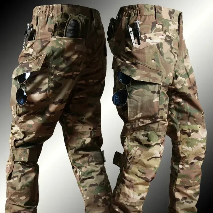 Camouflage pants shown from front and back on a gray background