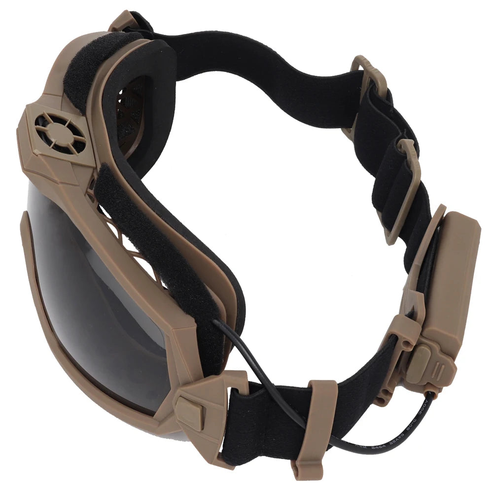 Tan and black goggles with a strap on a white background