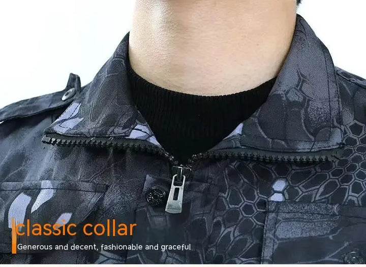 Close-up of a black patterned jacket with a classic collar, featuring text on a white background.