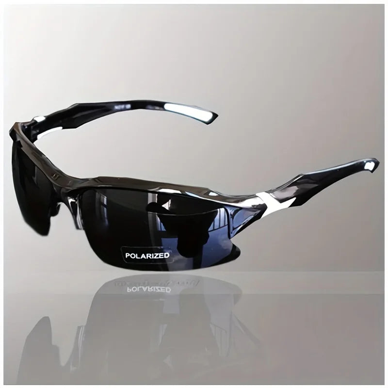 Black polarized sunglasses on a reflective surface with a light gray background