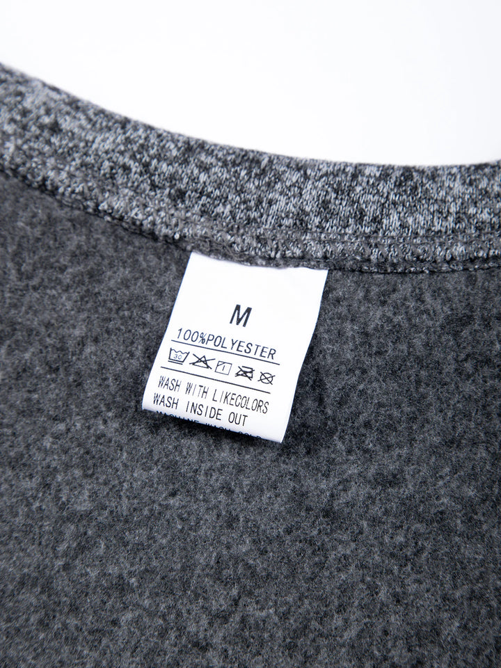 Close-up of a gray fabric with a label on a white background