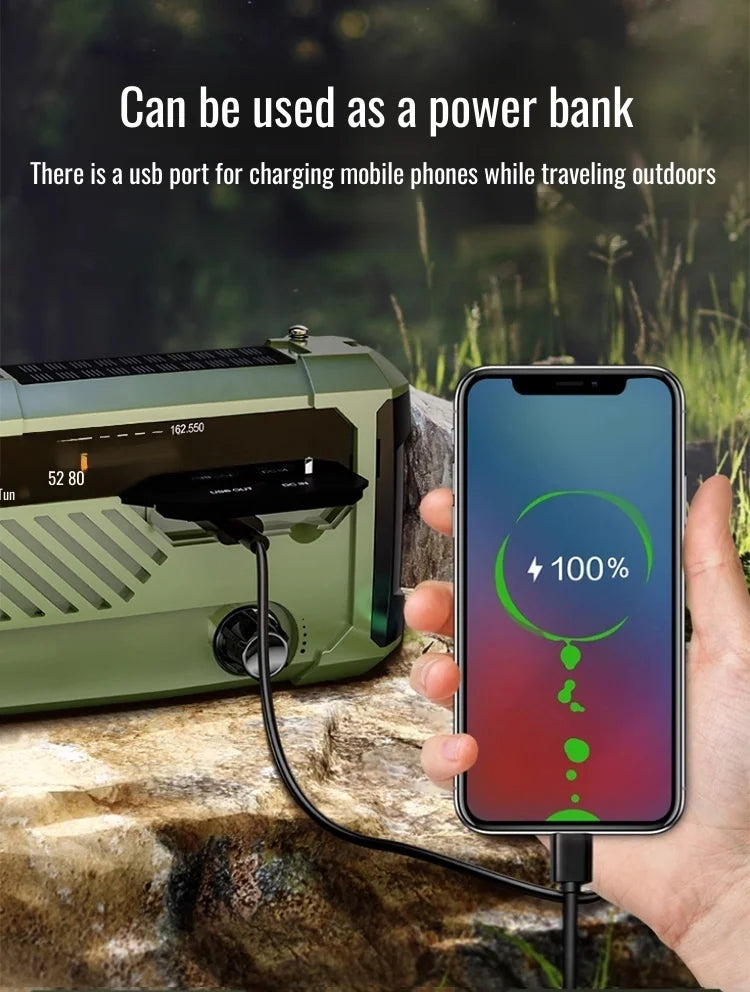 Green portable radio with USB cable charging a smartphone outdoors
