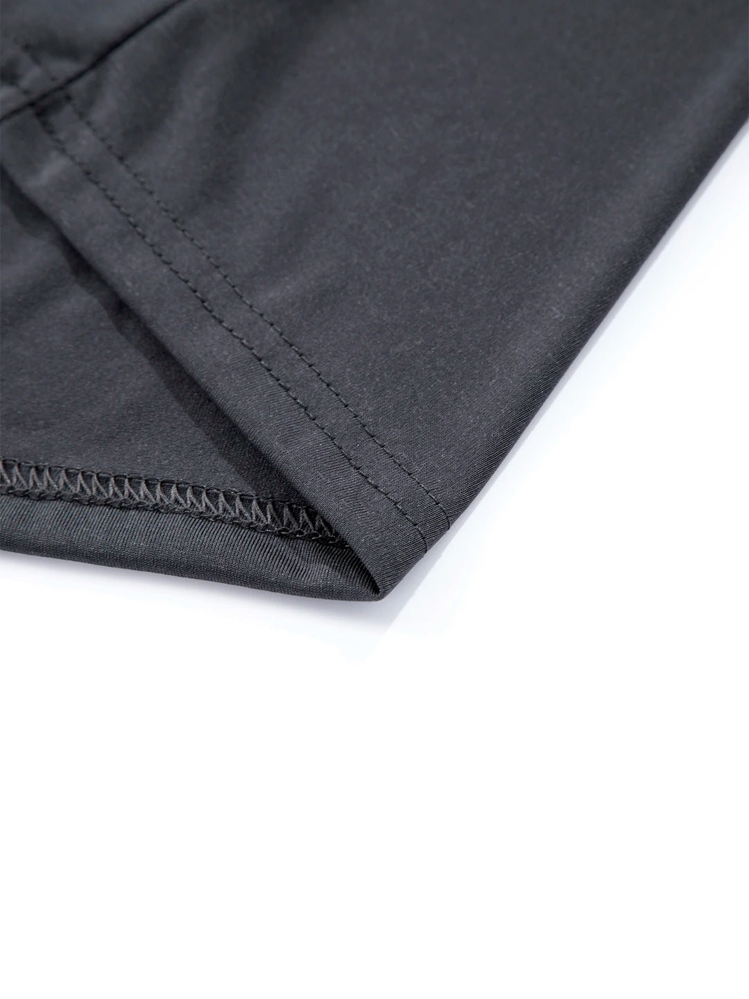 Close-up of a black fabric with a zipper on a white background