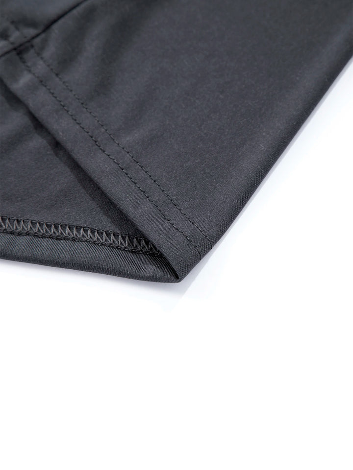 Close-up of a black fabric with a zipper on a white background