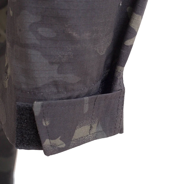 Close-up of a camouflage-patterned pocket on a jacket with a white background