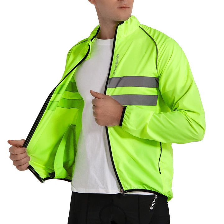 Person wearing a bright green reflective jacket on a white background