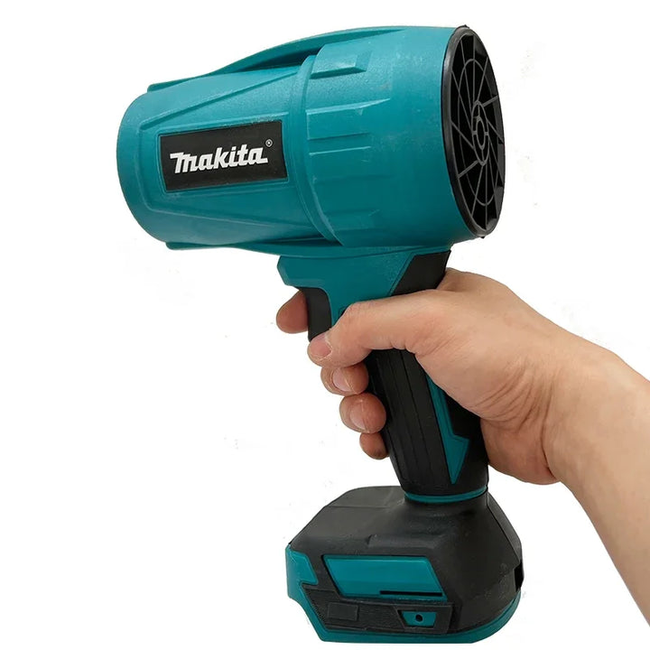 Hand holding a Makita cordless drill on a white background