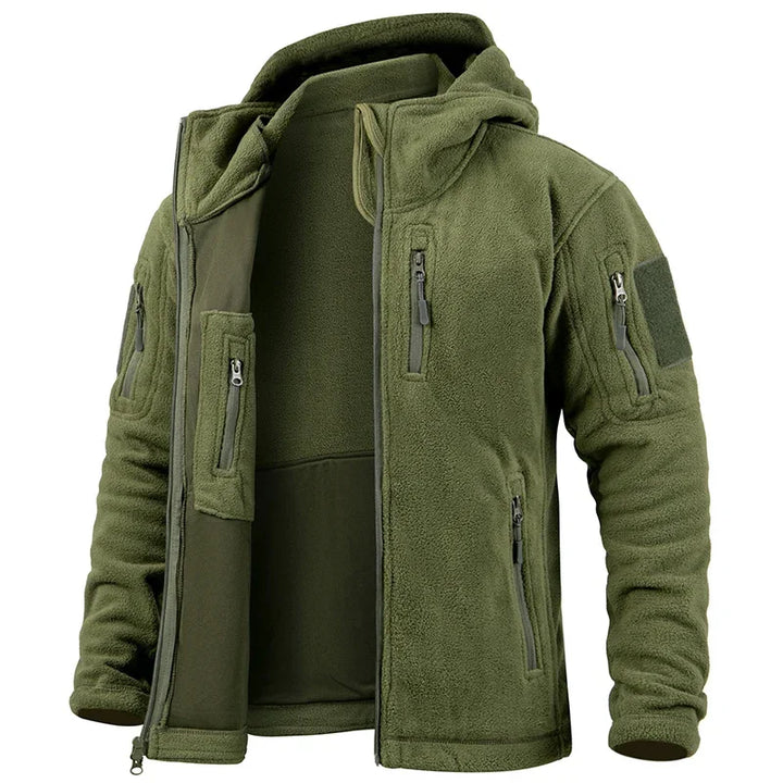 Green fleece jacket with multiple pockets and zippers on a white background
