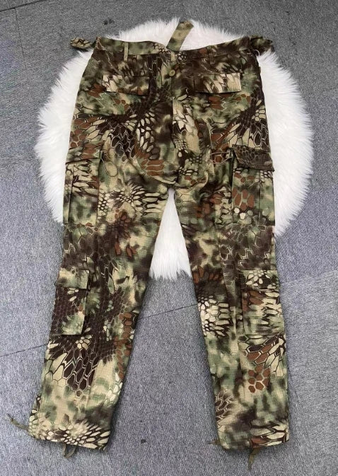 Camouflage pants with butterfly patterns on a textured surface