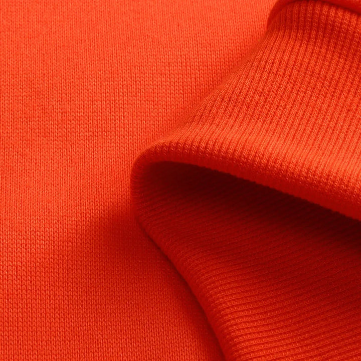 Close-up of orange fabric with a textured pattern