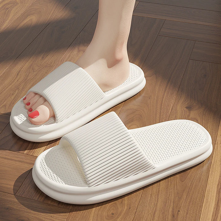 White slippers on a wooden floor