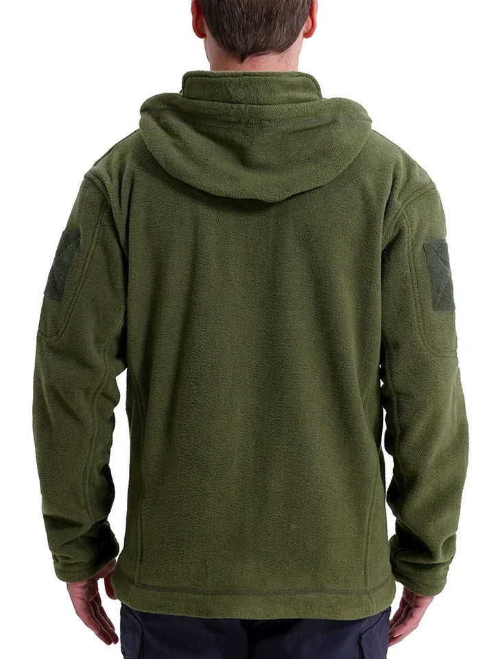 Green hooded jacket worn by a person on a white background