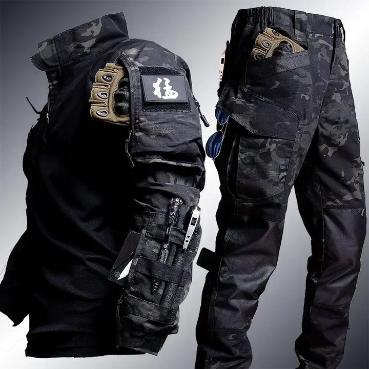 Tactical gear including a jacket and pants with various pockets and attachments on a gray background.