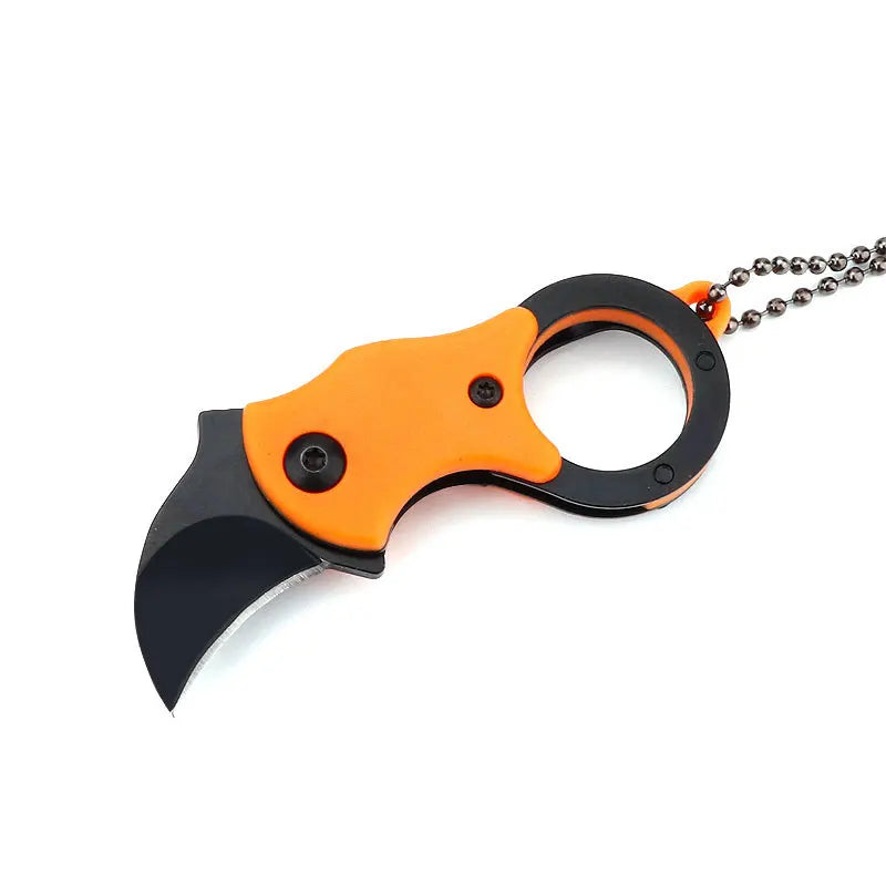 Folded knife in hand highlighting small and discreet size