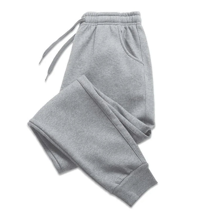 Pair of joggers displayed folded with waistband visible