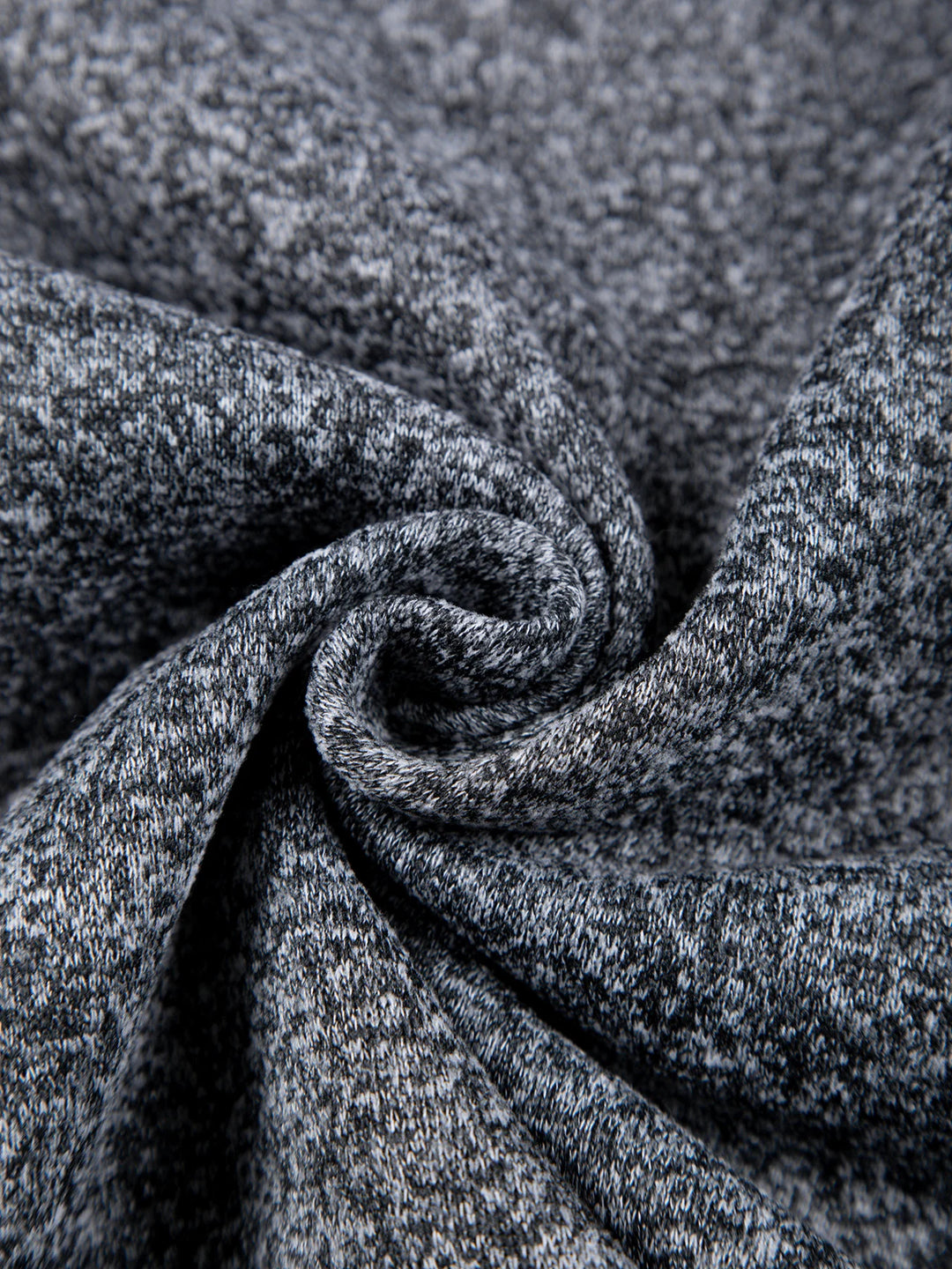 Close-up of gray textured fabric with a swirl pattern
