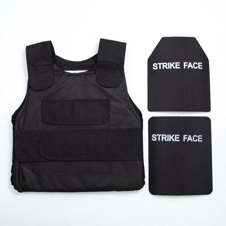 Black bulletproof vest and two ballistic plates on a white background