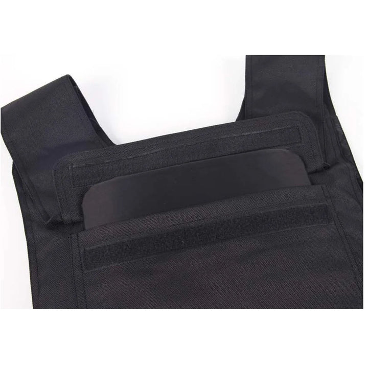 Black tactical vest with multiple pockets on a white background