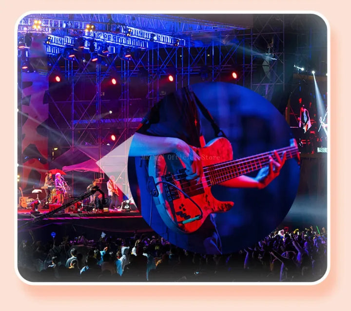 Large blue bass guitar on a stage with musicians and audience in the background