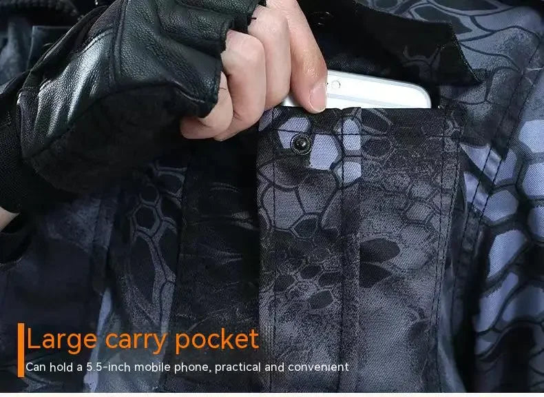 Person holding a black jacket with a large carry pocket, showing a phone inside.