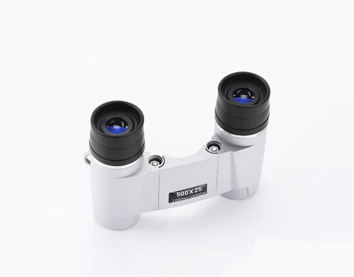 Compact binoculars on a white background