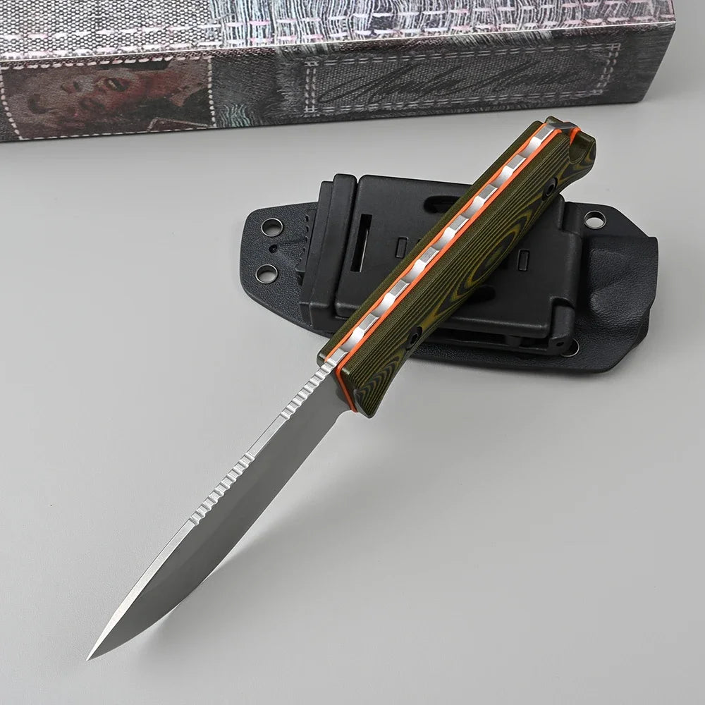 Folding knife with a sheath on a gray surface