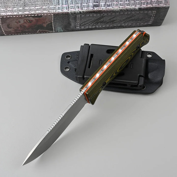 Folding knife with a sheath on a gray surface