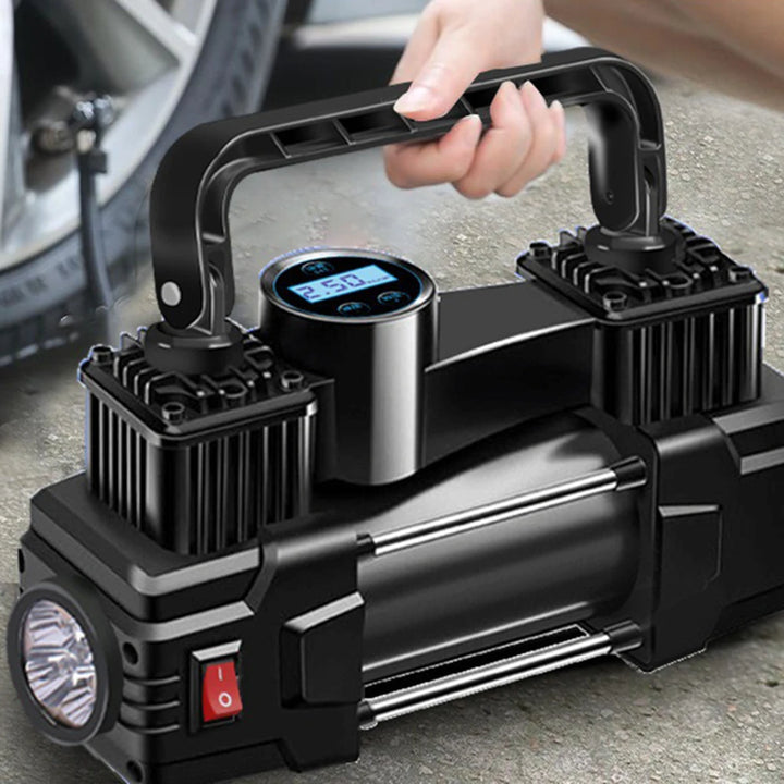  Heavy-duty 12V air compressor with dual cylinders and LED light, placed next to a car tire for quick inflation