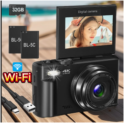 WiFi-enabled 4K vlogging camera with flip-up screen showing a woman posing near the beach, placed on a sunny wooden boardwalk with dual batteries, USB cable, and 32GB card.