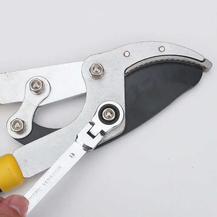 Close-up of a heavy-duty cutting tool for hardware applications, featuring a strong metal grip