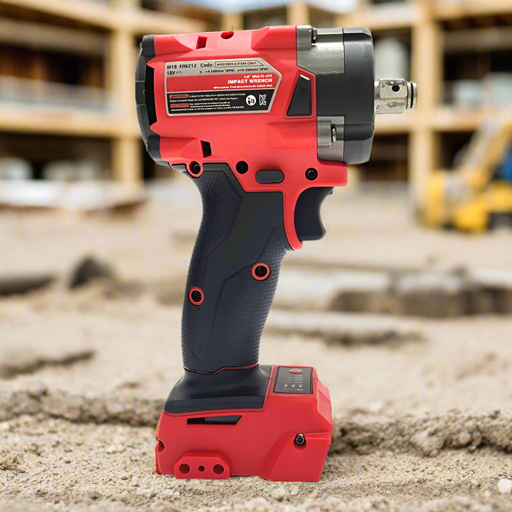 Single red-and-black SmartGearPros impact wrench standing on packed dirt at a construction site.