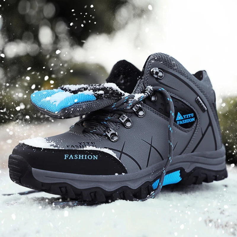 Gray winter boots with blue accents, designed for extreme snow and ice conditions.