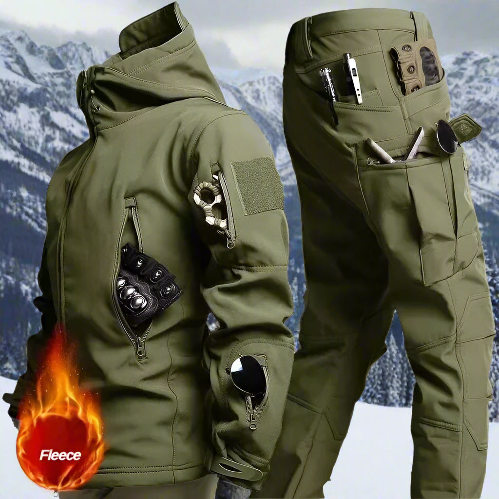 Military green tactical jacket and pants set shown in front of a wintry mountain scene, built with weather-resistant fabric and fleece interior for extreme outdoor conditions.