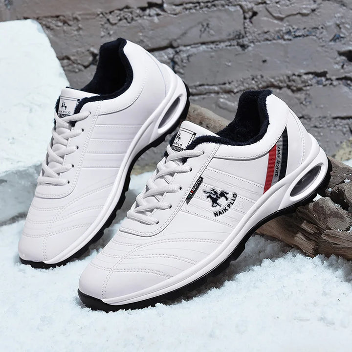 White sneakers with a mesh upper, offering breathability and lightweight comfort.